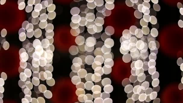 Defokussierte LED-Teilchenleuchten, die nachts blinken — Stockvideo