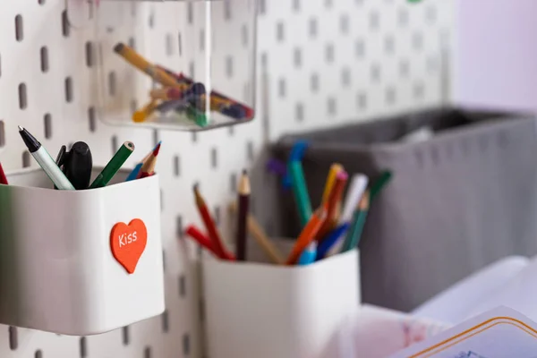 Pencil cup with pencils attached to the wall, design, school, close-up