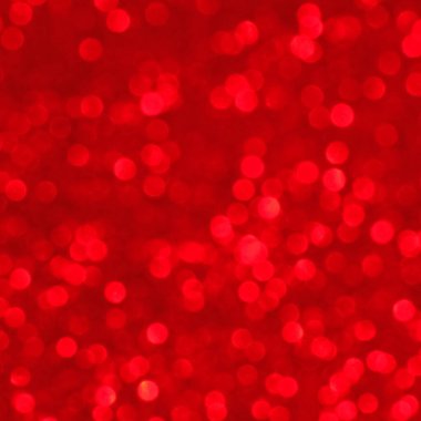 Soyut parlak parıltılı noel ya da yeni yıl arkaplanı. Pırıl pırıl parlayan bir arka plan. Parlak kırmızı ışık, pullar kıvılcımlar ve parlak folyo arka plan.