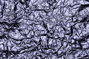 Doku arkaplanı için parlak buruşuk yüzeyi olan grafit folyo arka planı. Yanardöner yüzey kırışık folyo.