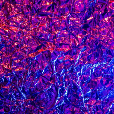 Pembe ve mavi renkli folyo arka plan, dokunun arkaplanı için parlak buruşuk yüzey. Yanardöner yüzey kırışık folyo