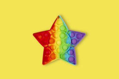 Stres önleyici oyun oynuyoruz. Pop Fidget Duyusal Otizm Oyuncağı Özel Stres Rahatlaması Gerekiyor. Silikon Basınç Rahatlatıcı Oyuncak Çocuklar, Çocuklar, Yetişkinler için Yıldız.