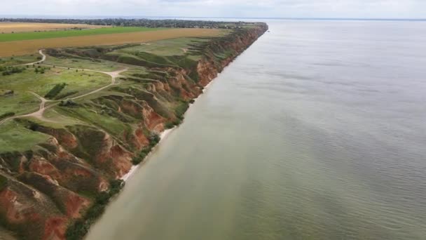 Drone aerial view on Rocky cliffs and the deep sea. Mountains and black sea. — Stock Video