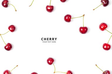 Beyaz arka planda kiraz çerçevesi. Fotokopi alanı olan pankart. Beyaz arka planda izole edilmiş olgun kırmızı kiraz. Makro fotoğraf yakın çekim.
