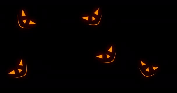 Oranje enge pompoen gezichten verschijnen op zwarte achtergrond. Halloween concept. animatie met 4k-resolutie. — Stockvideo