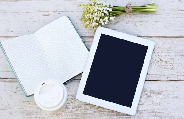 Diary, a tablet computerand  lilies of valley — Stock Photo, Image