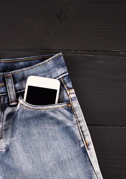 Jeans and mobile phone — Stock Photo, Image