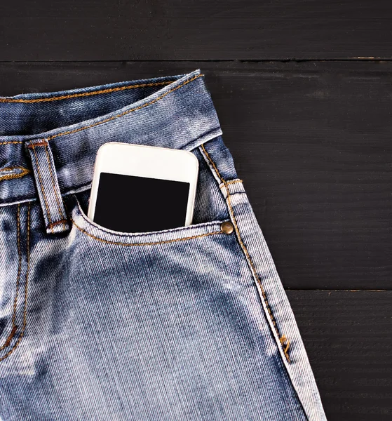 Jeans and mobile phone — Stock Photo, Image