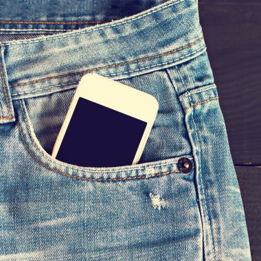 Kot pantolon ve cep telefonu