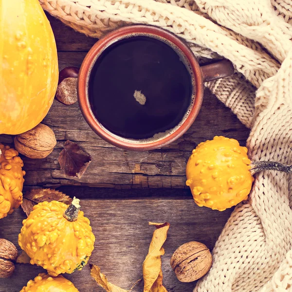 Cup of coffee, pumpkin, autumn leaves