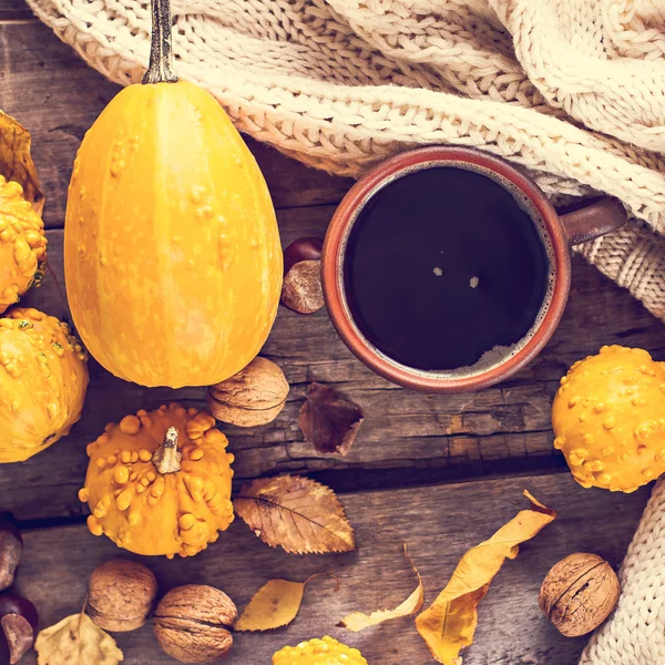 Cup of coffee, pumpkin, autumn leaves