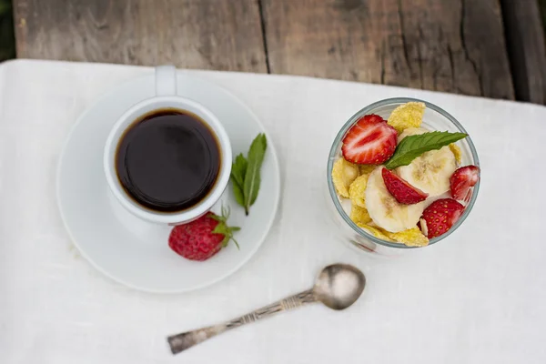 Dessert with strawberries.Cheese, strawberry, banana, cornflakes on the table. Breakfast.