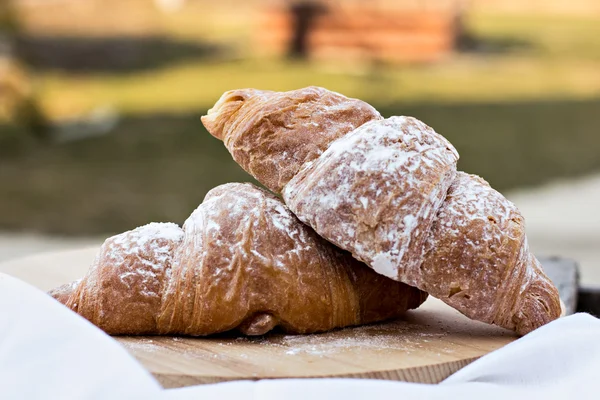 Two Croissants on the wooden table. — Stock Photo, Image