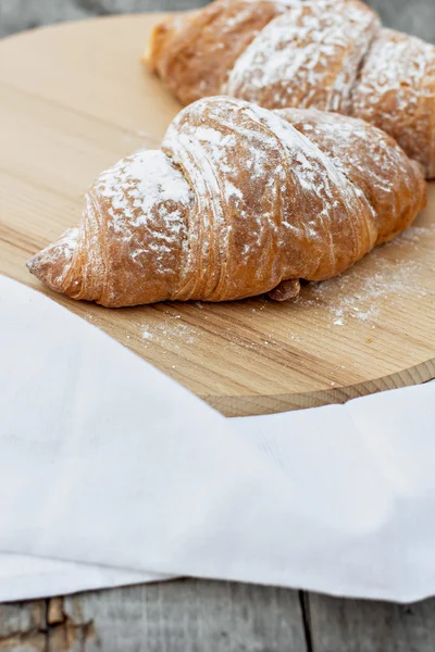 Two Croissants on the wooden table — Stock Photo, Image