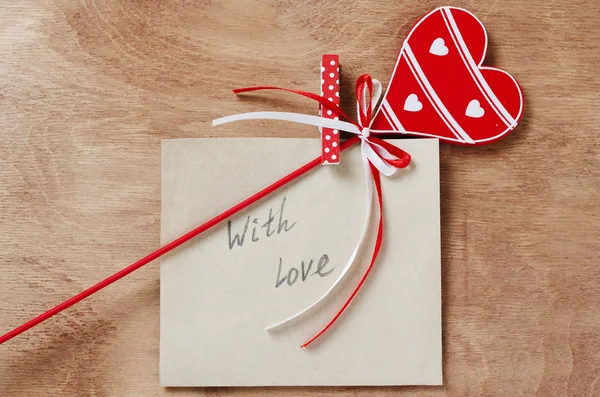 Card with Message With Love in the Letter and wooden red heart o — Stock Photo, Image