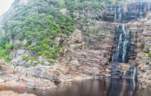 Tourists at waterfall