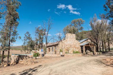 SEWEWEEKSPOORT, SOUTH AFRICA - APRIL 6, 2021: Hall and swimming pool at Op Die Plaas camping site at Sandrivier farm near the top of Seweweekspoort in the Swartberg Mountains