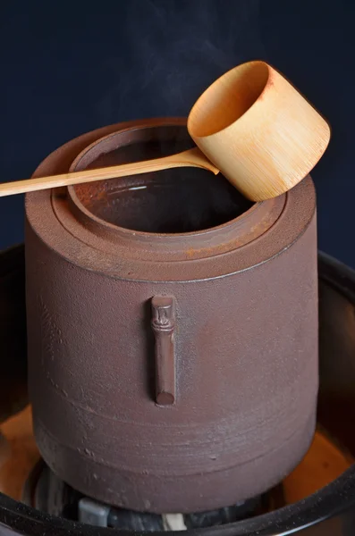 Bamboo ladle and kettle — Stock Photo, Image