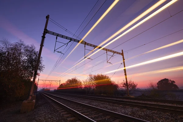 Train at the sunrise — Stock Photo, Image
