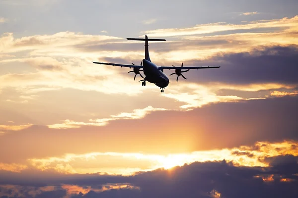 Airplane at the sunset — Stock Photo, Image