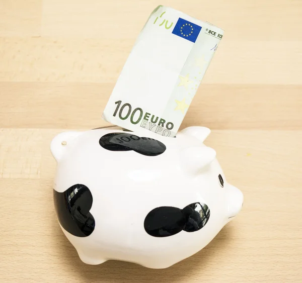 Piggy bank with hundred euros — Stock Photo, Image