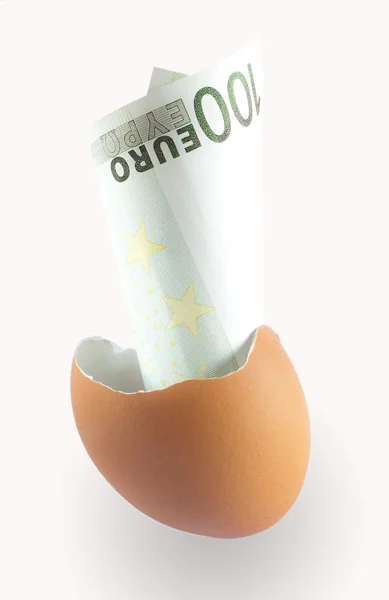 Broken egg with hundred euros — Stock Photo, Image