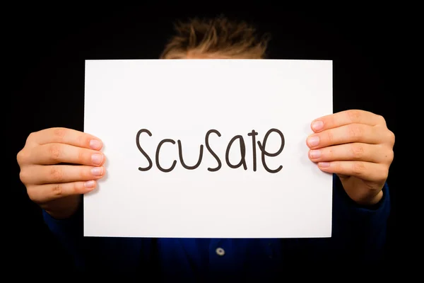 Child holding sign with Italian word Scusate - Sorry — Stock Photo, Image