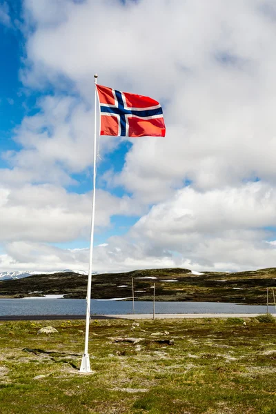 Norwegian flag on flagpole in Norway — Stock Photo, Image