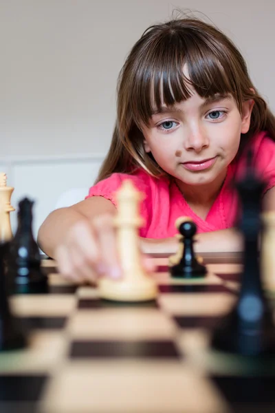 Girl and chess board — Stock Photo, Image