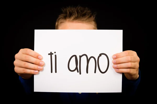 Child holding sign with Italian words Ti Amo - I Love You — Stock Photo, Image