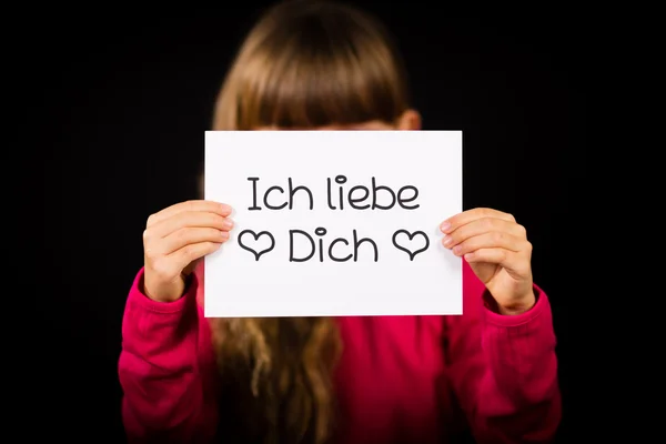 Child holding sign with German words Ich liebe Dich - I Love You — Stock Photo, Image