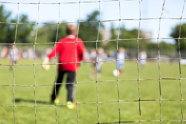 Gol líquido e guarda-redes desfocado — Fotografia de Stock