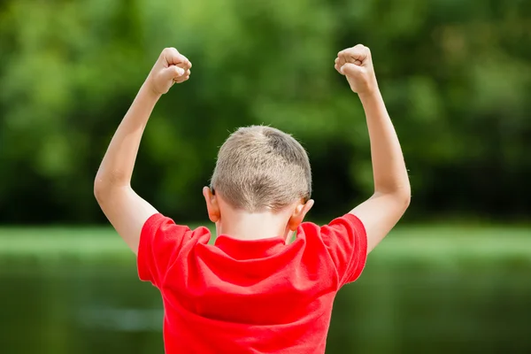 Child celebrating success or victory — Stock Photo, Image