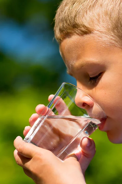 Boy drinking water — Stock Photo, Image