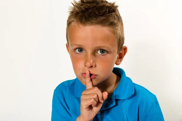 Boy making keep quiet gesture — Stock Photo, Image