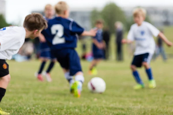 Blurred kids playing soccer — Stock Photo, Image