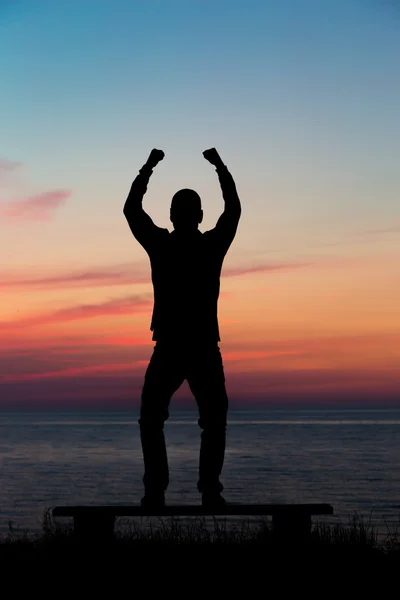 Man with raised arms — Stock Photo, Image