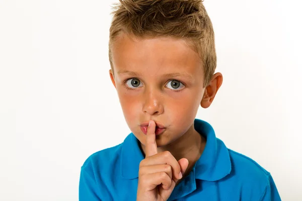 Boy making keep quiet gesture Stock Picture