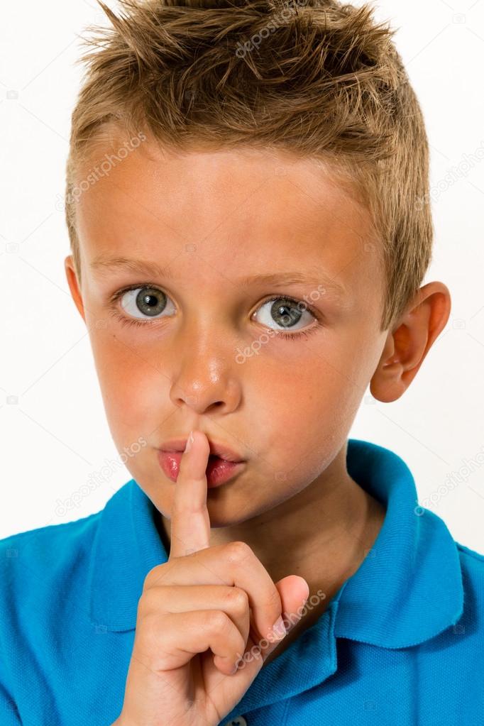 Boy making keep quiet gesture