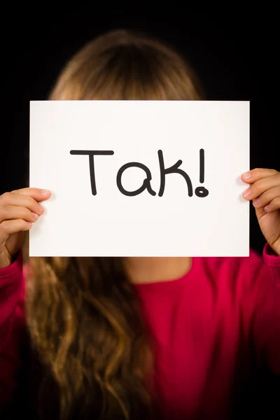 Child holding sign with Danish word Tak - Thank You — Stock Photo, Image