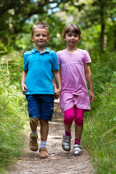 Walking boy and girl — Stock Photo, Image