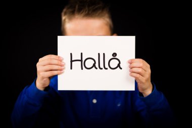 İsveç kelime Halla - Merhaba işaretiyle tutan çocuk