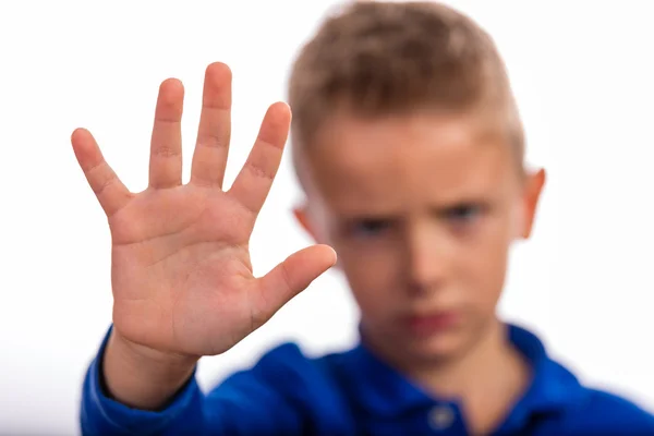 Boy making a stop gesture with his hand — Stock Photo, Image