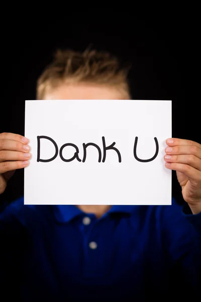 Child holding sign with Dutch words Dank U - Thank You — Stock Photo, Image