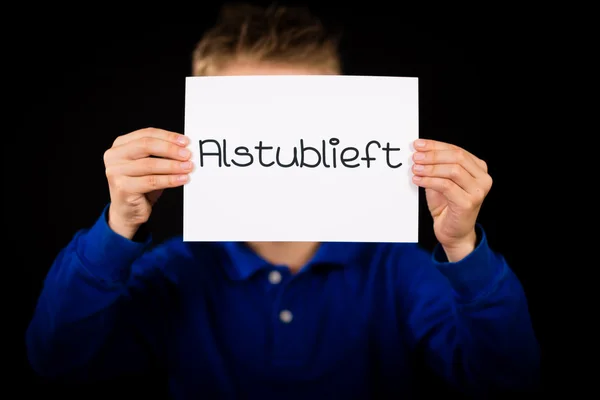 Child holding sign with Dutch word Alstublieft - Please — Stock Photo, Image