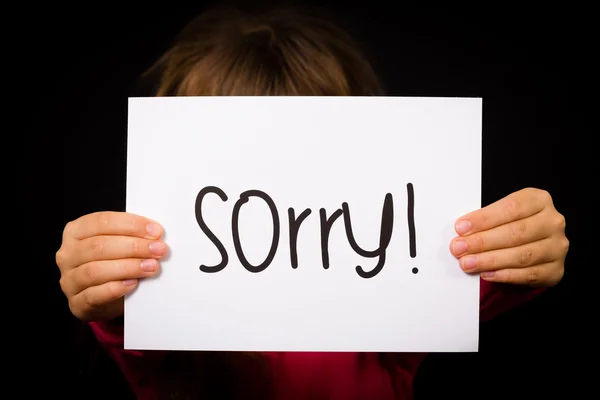 Dziecko gospodarstwa znak przepraszam — Zdjęcie stockowe