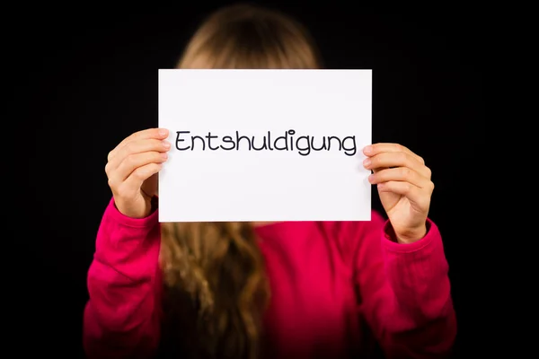 Child holding sign with German word Entschuldigung - Sorry — Stock Photo, Image