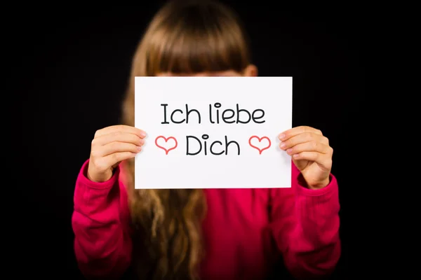 Child holding sign with German words Ich liebe Dich - I Love You — Stock Photo, Image
