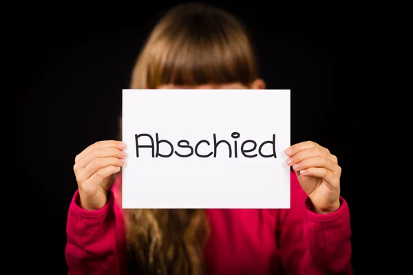 Child holding sign with German word Abschied - Goodbye — Stock Photo, Image