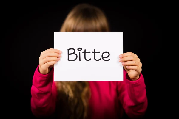 Child holding sign with German word Bitte - Please — Stock Photo, Image